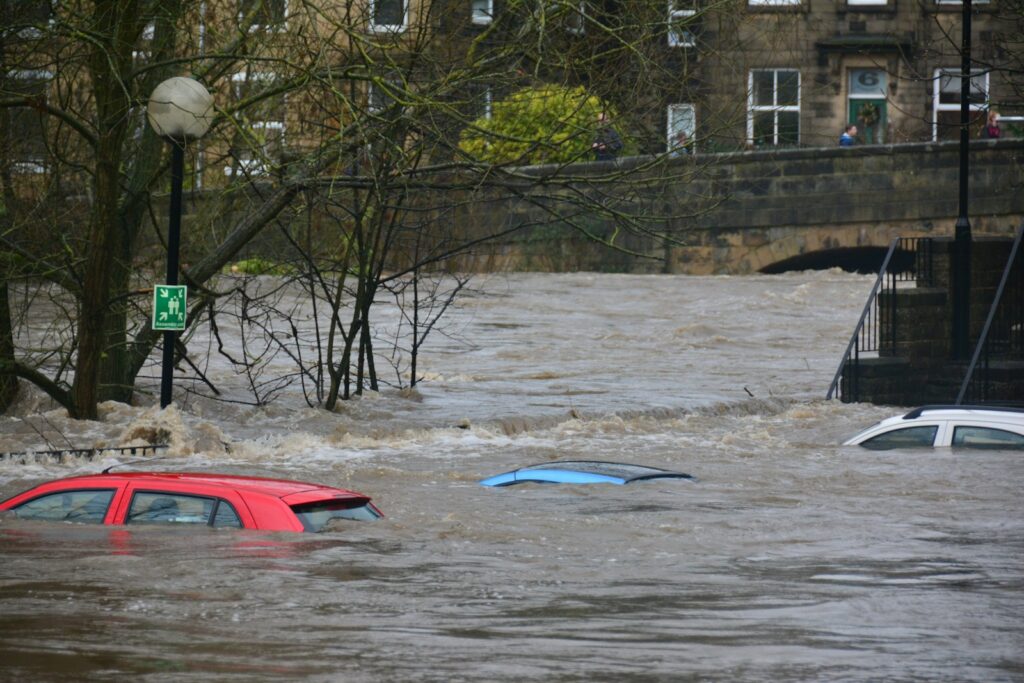 car on body of water of a flooded street