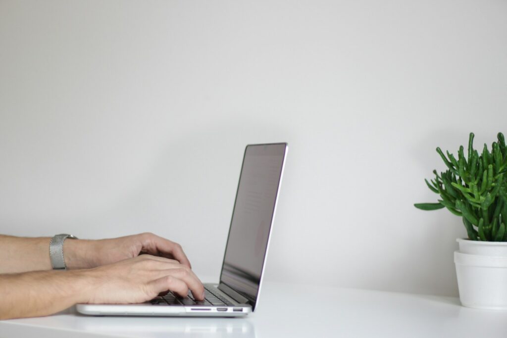 person using laptop to change their ministays cancellation policy