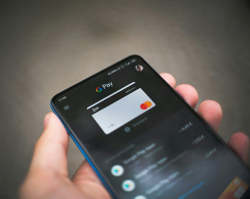 black smartphone making a payment with credit card