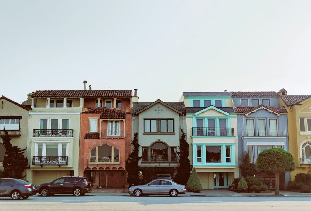  multicolored building during daytime in peaceful neighborhood