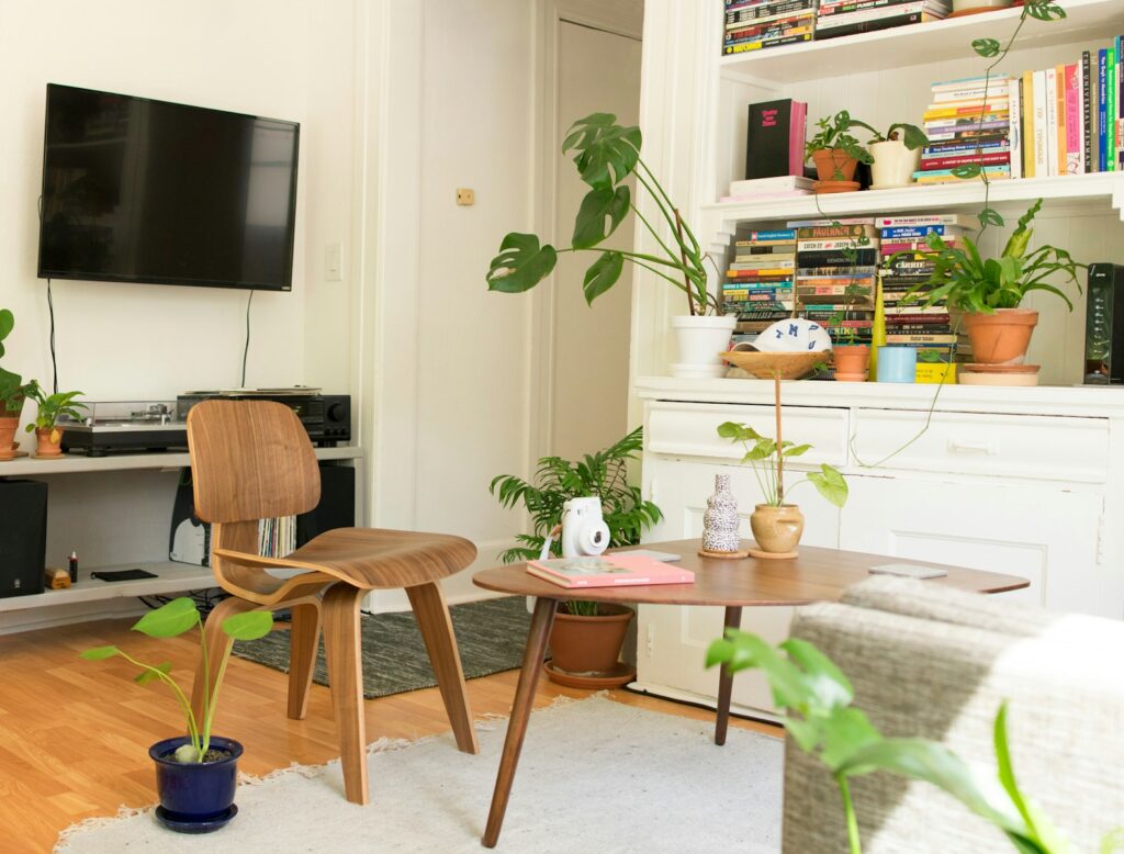 brown wooden table and chair beside bookshelf in ministays apartment